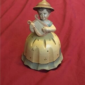 Italian music box girl figurine with harp.  Plays Moon River.